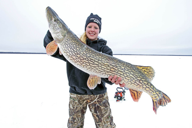 youth girl holding Northern Pike fish