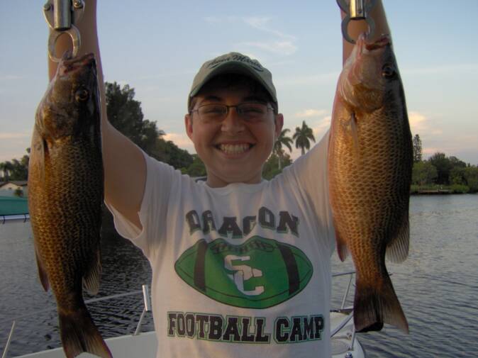 kid holding fish